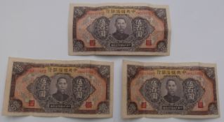 Three Chinese 1943 500 Yuan notes with consecutive numbers.