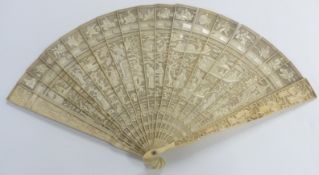 A 19thC Chinese ivory fan of 21 sticks, each with carved decoration of figures, dragons, boats