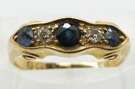 Edwardian 18ct gold ring set with three round cut sapphires and two diamonds, Chester 1907, in