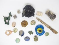 A quantity of ancient Roman and near Eastern artefacts, amulets including head, bronze ibex,