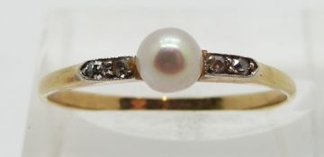 Art Deco 18ct gold ring set with a pearl, with diamonds to the shoulders, size Q/R