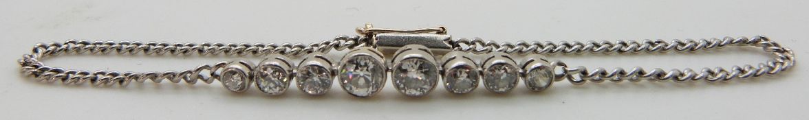 An 18ct white gold bracelet set with eight old cut diamonds, total diamond weight approximately 1.