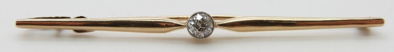 A 9ct gold bar brooch set with an old cut diamond measuring approximately 0.2ct