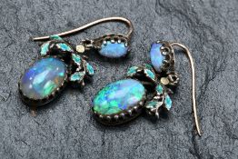 A pair of Victorian earrings set with two opal cabochons and enamel, 2.5cm drop