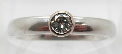 A platinum ring set with a round brilliant cut diamond of approximately 0.2ct, with HRD report, size
