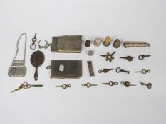 Hallmarked silver sherry bottle ticket with feature hallmarks, two silver thimbles including Charles