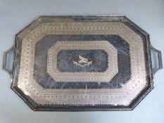 A large silver plated twin handled octagonal tray with engraved decoration, length 70.5cm