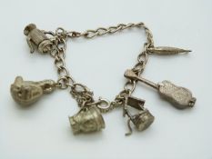 A silver charm bracelet with six charms