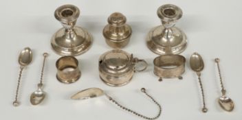 A quantity hallmarked silver items to include a pair of candlesticks, mustard, salt, two salt