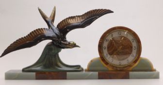 An Art Deco spelter and agate clock with sea bird decoration, sword hands and arabic numerals,