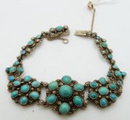 A silver bracelet set with turquoise cabochons and pearls, possibly Austro Hungarian