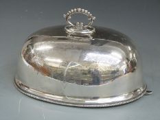 A large silver plated meat dome, length 36cm
