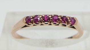 A 14ct gold ring set with rubies, size L/M