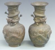 Pair of Chinese bronze or similar dragon vases with character marks to base, height 25.5cm