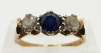 A 9ct gold ring set with a sapphire and paste, size L