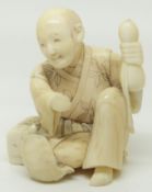 A 19thC Chinese carved ivory netsuke of a seated man with a tortoise, height 3.2cm