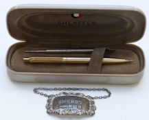 Hallmarked silver sherry label and a Sheaffer ballpoint pen