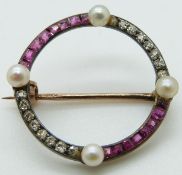 A late Victorian brooch set with rubies, diamonds and pearls.