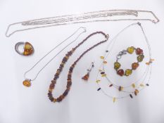 A beaded amber necklace, silver bracelet set with pressed amber, silver and amber necklace,