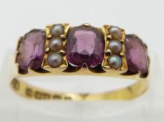 Edwardian 15ct gold ring set with garnets and seed pearls, Birmingham 1902, size Q