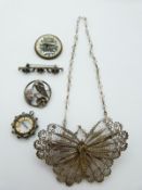 A filigree brooch in the form of a butterfly, silver brooch set with seed pearls, a reverse