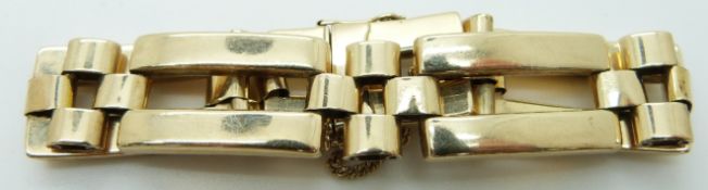 A 9ct gold bracelet made up of rectangular links by C & F, 22g