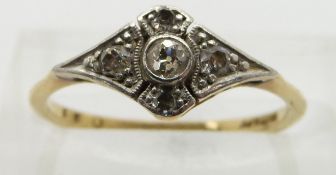 An 18ct gold ring set with diamonds in a platinum setting, size K