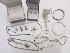 A collection of silver jewellery including necklaces, bracelets, earrings etc
