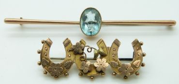 A 9ct gold brooch set with paste and a 9ct gold Edwardian brooch in the form of three horseshoes