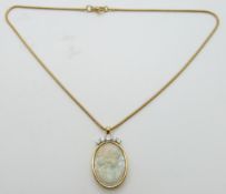 An 18ct gold necklace set with a carved opal panel depicting a young woman (7.7ct, Australia) set