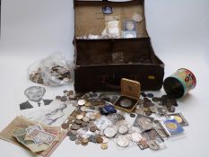 An amateur collection of UK and overseas coinage in a vintage suitcase