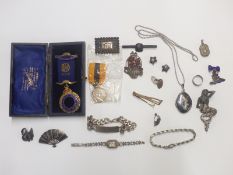 A collection of silver jewellery including identity bracelet, Siam pendant, brooches and earrings,