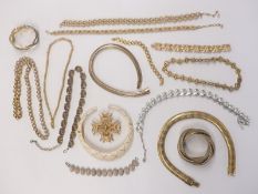 A collection of large gold tone necklaces and bracelets including Napier, Trifari, snake bangle etc