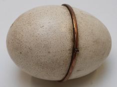 A 19thC etui case, the egg shell case opening to reveal a fitted gilt interior set with ivory