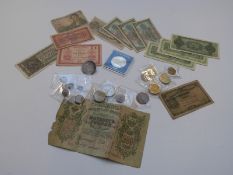 A small collection of coins to include some silver, George III crown / brooch, Maria Theresia,