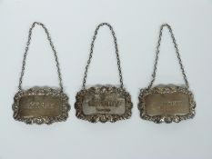 Three modern hallmarked silver bottle tickets for sherry, whisky and brandy, weight 41g