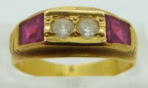 A yellow metal ring set with white sapphires and synthetic rubies, size M