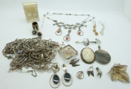 Eighteen silver necklaces, three silver bracelets, silver pendant, brooch set with shell, lucite