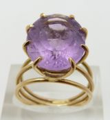 A 9ct gold ring set with an oval cut amethyst, size N