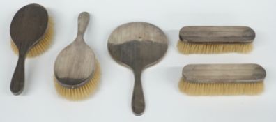 George V Art Deco hallmarked silver five piece dressing table set including hand mirror,