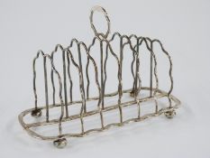 Edward VII hallmarked silver seven bar toast rack raised on four ball feet, London 1905 maker Samuel