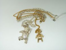 A 9ct gold teddy pendant and chain (3.1g) and silver teddy bear pendant and chain