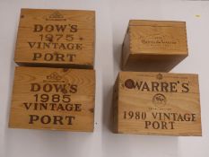 Four vintage port boxes/cases comprising Warre's 1980, Dow's 1985 and 1975 and Quinta de Vesuvio