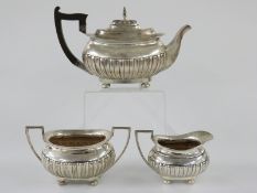 Edward VII Scottish hallmarked silver three piece tea set with reeded lower section, Glasgow 1908