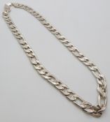 A white metal necklace made up of curb links