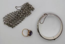 A 14ct gold ring set with a synthetic colour change sapphire, a hallmarked silver bangle and a