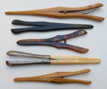 A collection of glove stretchers including hallmarked silver and ivory, mauchline ware etc