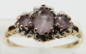 A 9ct gold ring set with amethyst and diamonds, size P