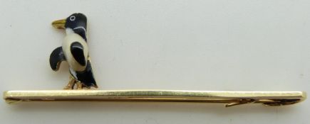 A 14ct gold brooch set with enamel and a blister pearl in the form of a penguin