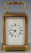 Late 19th / early 20thC brass carriage clock with Burman, Bristol to white enamel Roman dial and